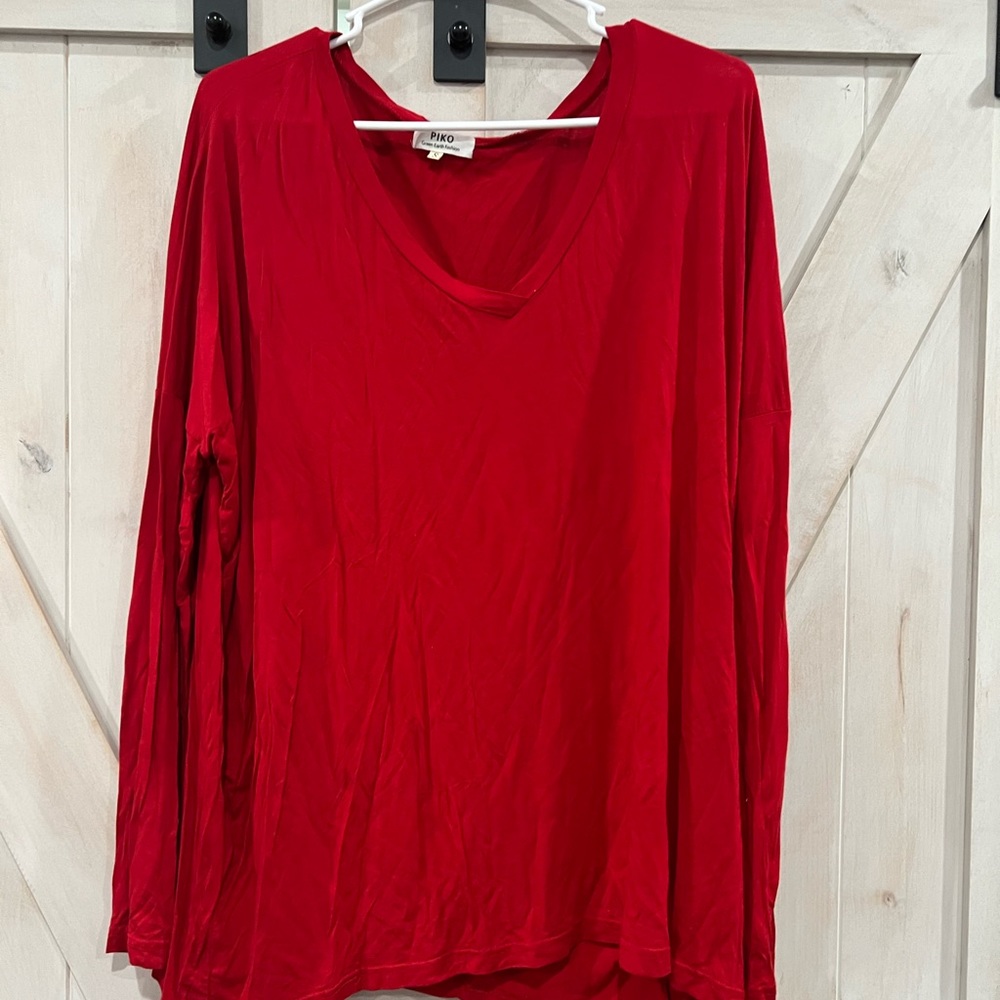 Red piko top gently used. Size small.